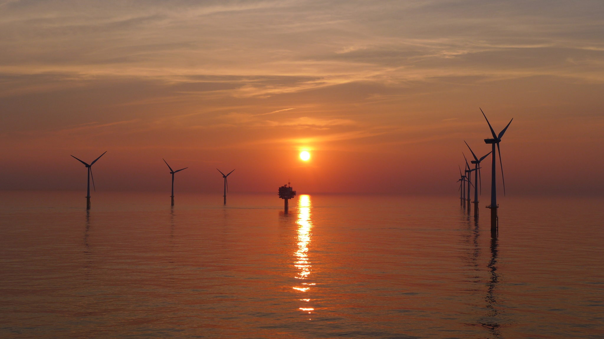 Wind turbines at sunset
